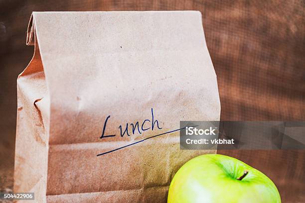 Brown Bag Lunch With Apple Stock Photo - Download Image Now - Packed Lunch, Bag, Lunch