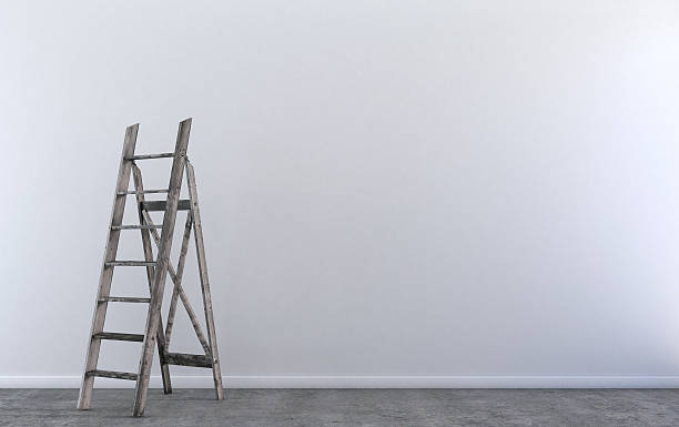 istock Wood step ladder in empty room 504424240