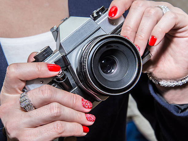 istock Red Nail Art Design and classic camera. 504424282