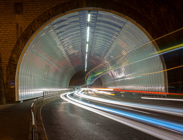 istock Car lights in a tunnel, city at night 504426332