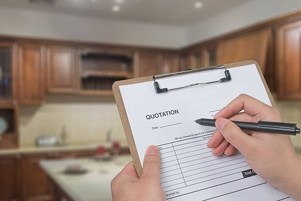 istock filling in a quote for kitchen renovation 504443848
