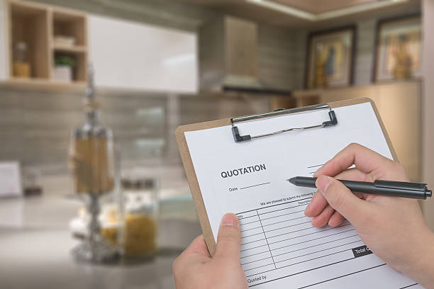 istock filling in a quote for kitchen renovation 504443862