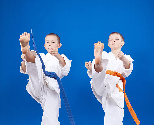 istock Blows legs the athletes beats in karategi 504445286