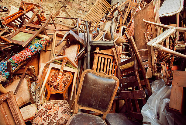 istock Abandoned store with old wooden chairs 504445408