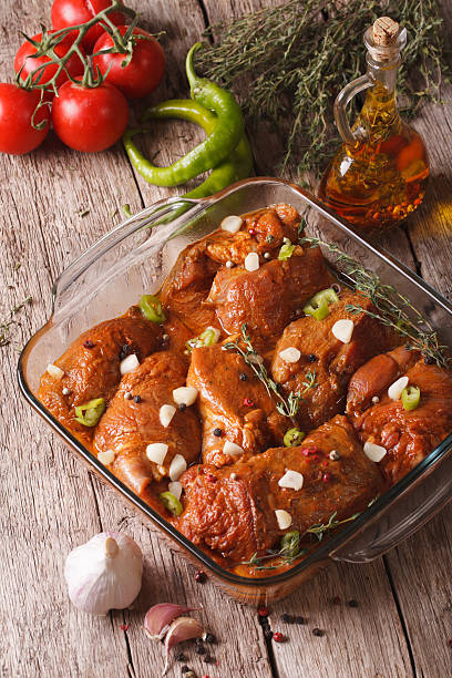 istock Meat in red marinade with spices, thyme, garlic and chilli 504445922