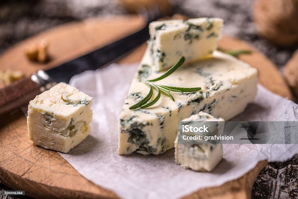 French Roquefort cheese Slice of French Roquefort cheese with walnuts Roquefort Cheese Stock Photo