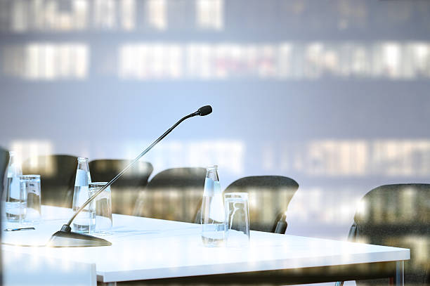 istock Microphone ready, allset for conference to begin. Business building reflection 504455752