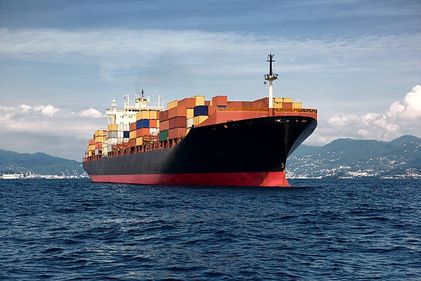 cargo freight, container ship in sea stock photo