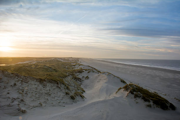 I took this picture on top of a dune on the island Terschelling (The Netherlands). On the left u see the dunes, and on the right you see the beach and the North Sea.