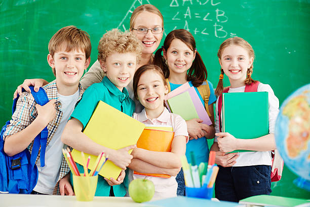 istock Schoolchildren with teacher 504476346