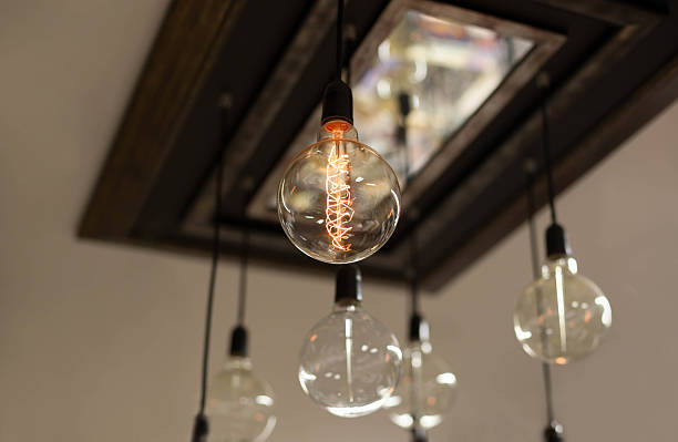 istock Set of antique light bulbs decor glowing light 504476744
