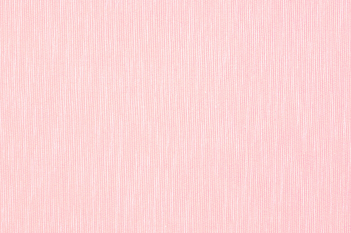 pink linen surface - close up of textile background - pastel tone