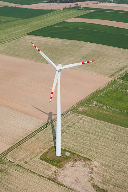 aerial view of wind turbine on a field Wind turbine on a field in Poland floating electric generator stock pictures, royalty-free photos & images