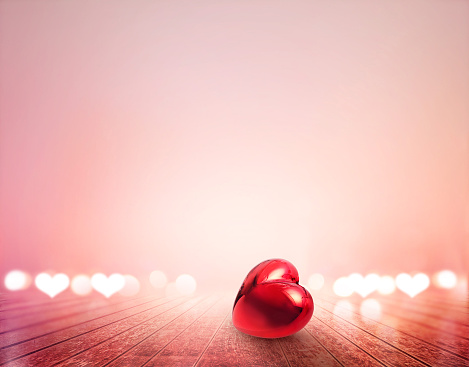 red heart and bokeh on wooden floor vibrant for background, soft and blur concept