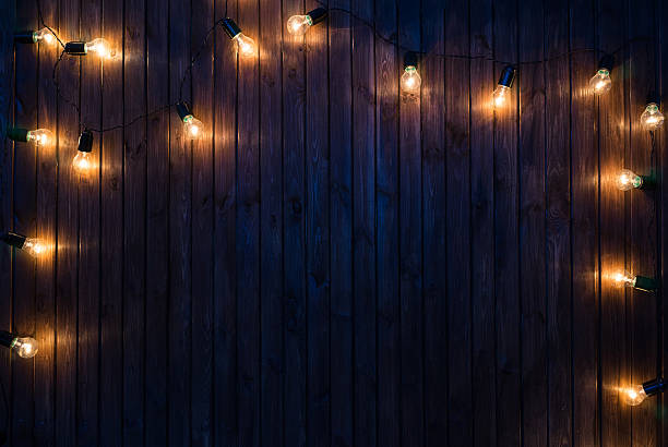istock Light bulbs on dark Wooden Background 504479252