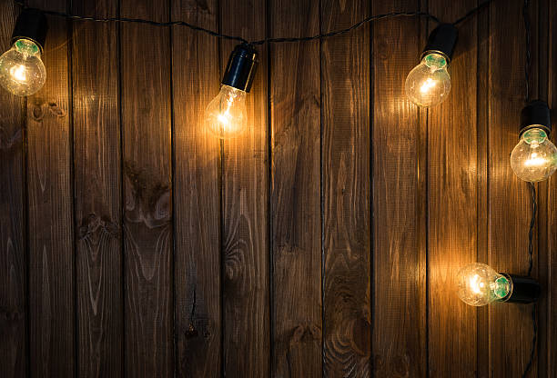 istock Light bulbs on dark Wooden Background 504479532