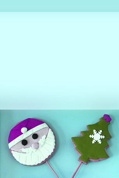 istock Santa And Christmas Tree Cookies Turquoise Background 504480242