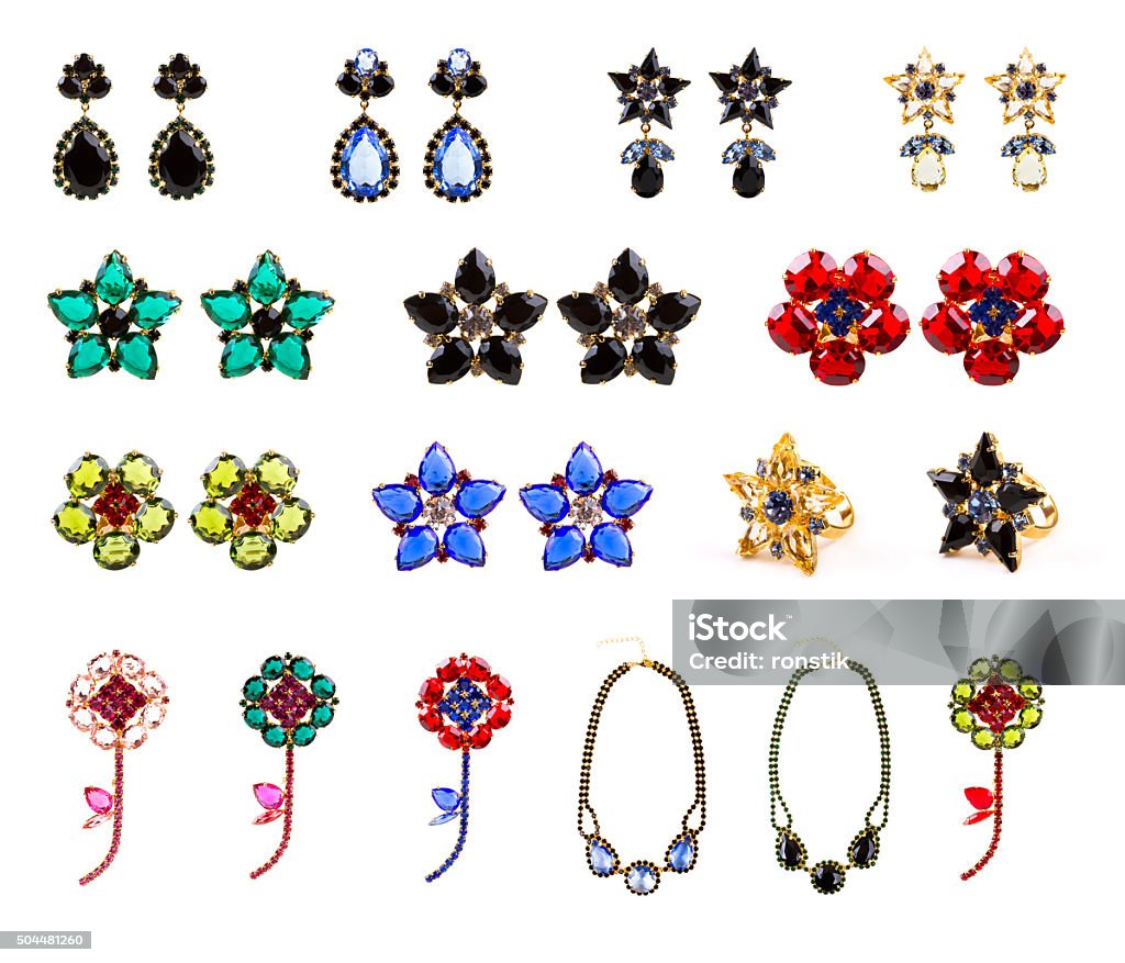 collection of crystal jewelry, earrings, rings, necklaces and brooches collection of crystal jewelry, earrings, rings, necklaces and brooches isolated on white background Cut Out Stock Photo