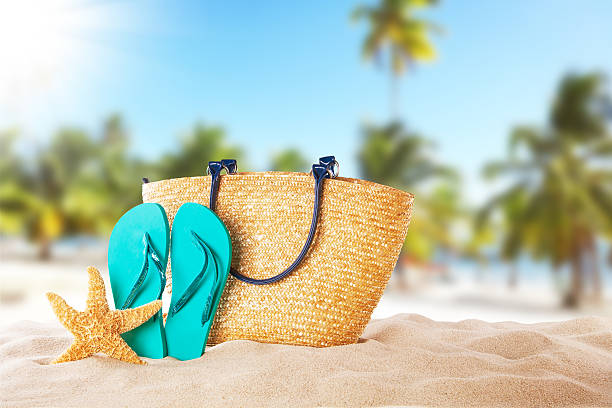 istock Summer beach with blue sandals and shells 504481703