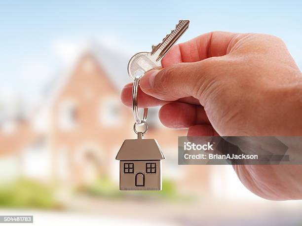 Giving House Keys Stock Photo - Download Image Now - Key, House, House Key