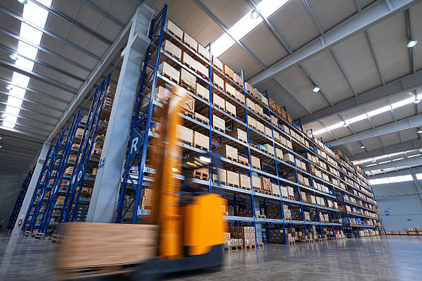 istock Forklift carrying cardboard box in warehouse. 504482874