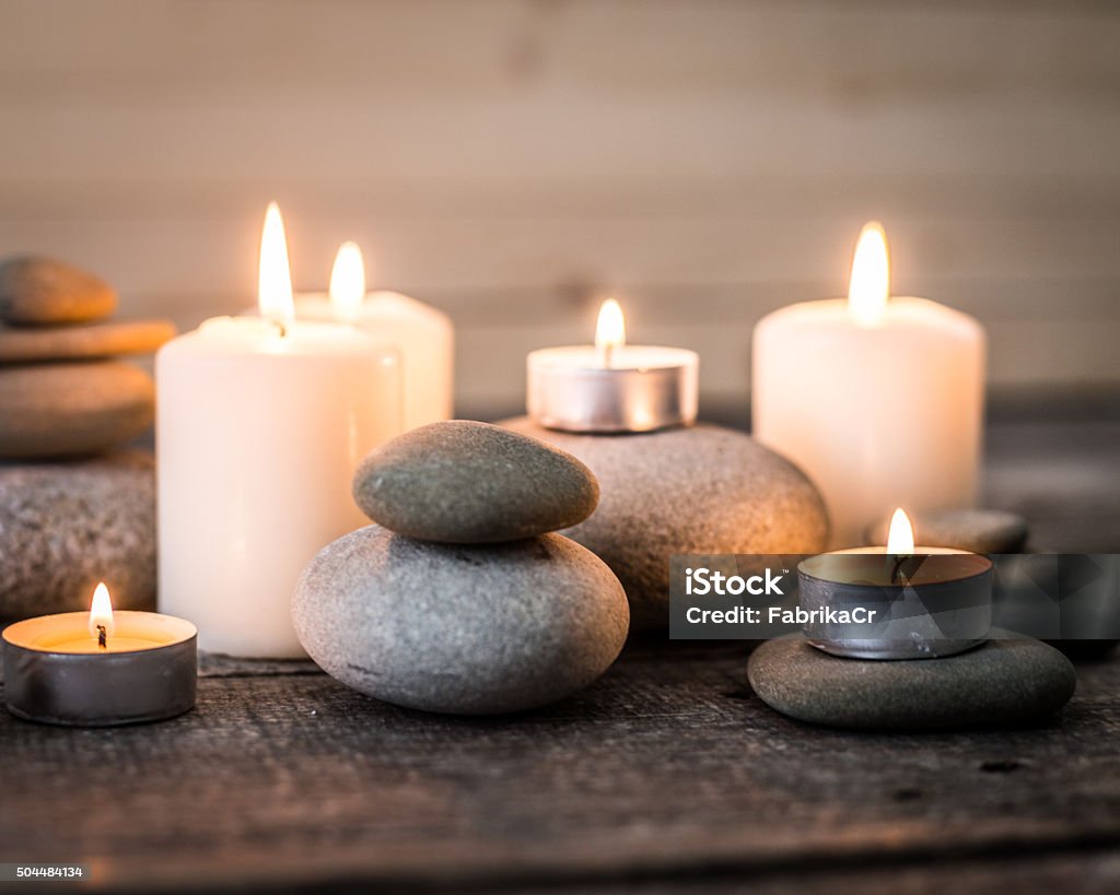 spa background with zen stones spa background with zen stones on wooden table Candle Stock Photo