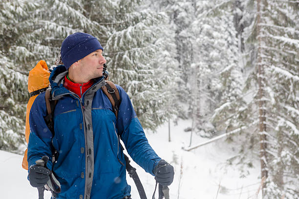 istock mountaineer in winter mountains 504485319