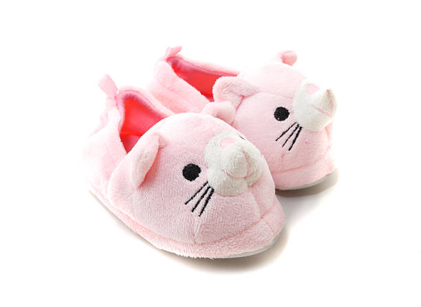 Pink Kids Slippers Pink Kids Slippers with mouse design isolated on white slipper stock pictures, royalty-free photos & images