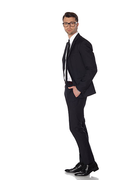 istock Business man in black suite on white background 504486027