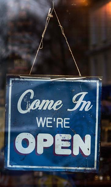istock blue come in we're open sign at caffe, white font 504486589