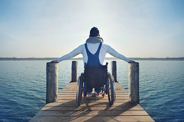 istock disabled Young man in wheelchair 504487345