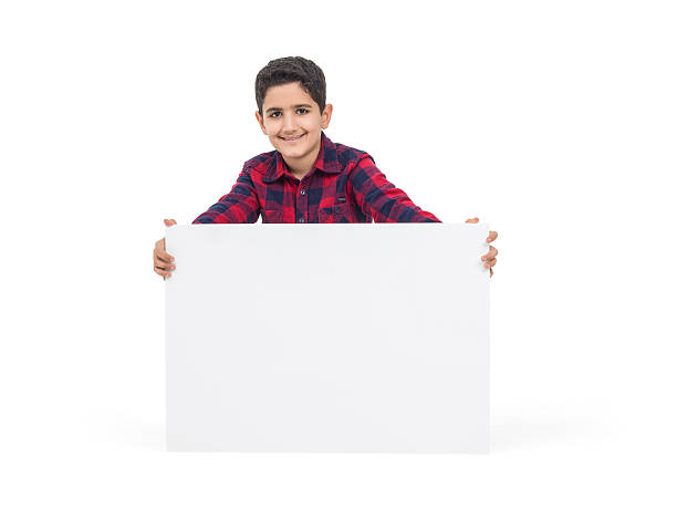 istock Happy young boy holding placart 504488186