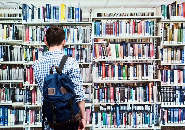istock Rear view of student in library 504488200
