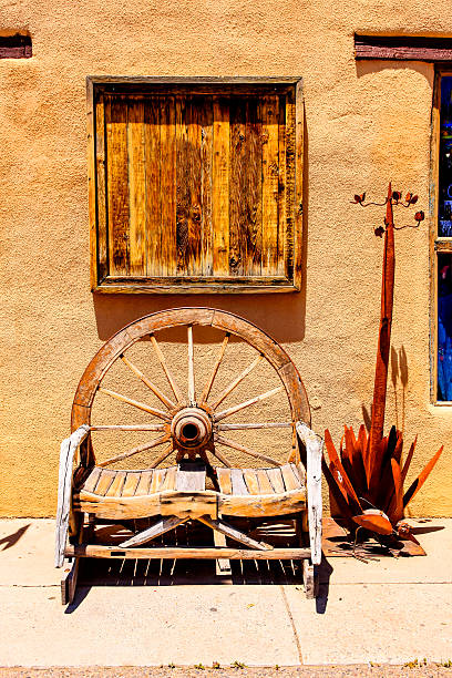 Albuquerque, NM, USA - June 17, 2015: Wooden wagon-wheel design bench seat on the sidealk in old town Albuquerque, New Mexico