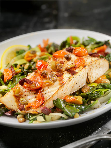 istock Grilled Halibut with Capers,Olives and Tomatoes 504488560