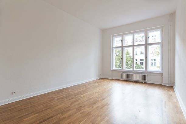 istock oak parquet floor in empty room 504489168