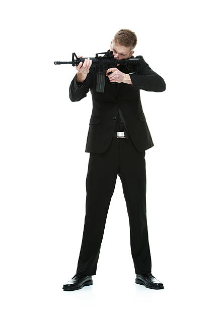 istock Businessman aiming with machine gun 504489230