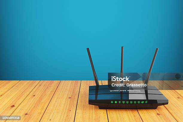 Wifi Wireless Router On Wooden Table Stock Photo - Download Image Now - Router, Wireless Technology, Internet