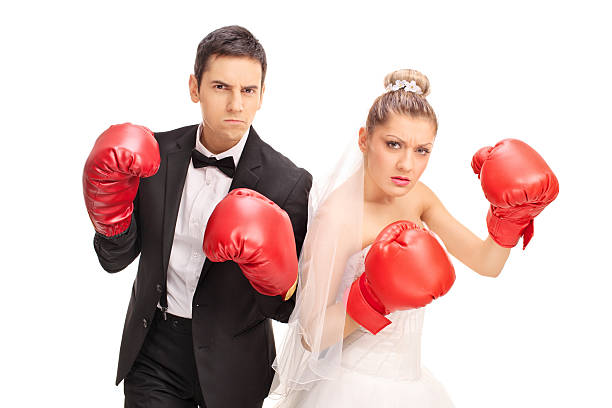 istock Newlywed couple posing with boxing gloves 504489626