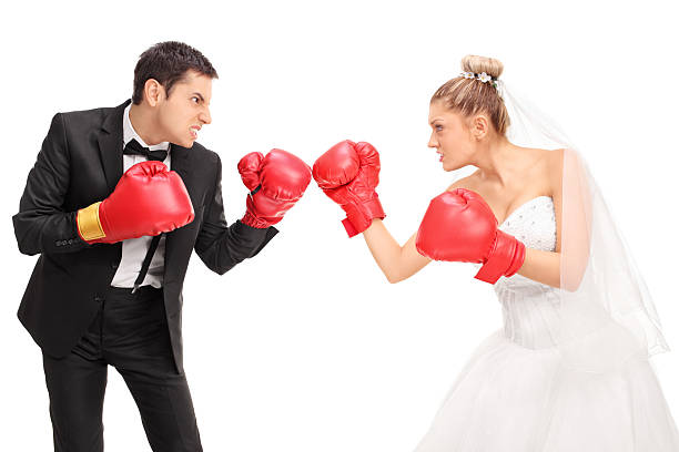 istock Young groom and a bride fighting each other 504490032