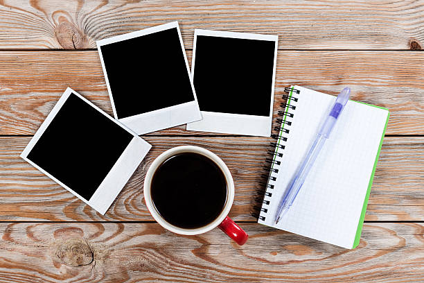 istock Workspace with coffee cup, instant photos, note paper and notebo 504490408