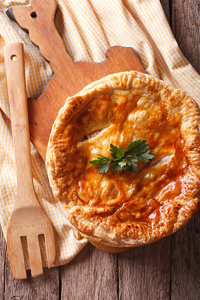 istock Rustic delicious chicken pie close-up. Vertical top view 504490858
