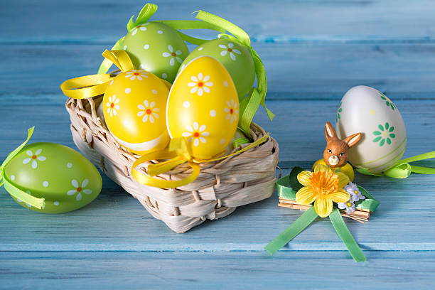 istock Colorful Easter eggs in a basket and rabbit statuette 504491412