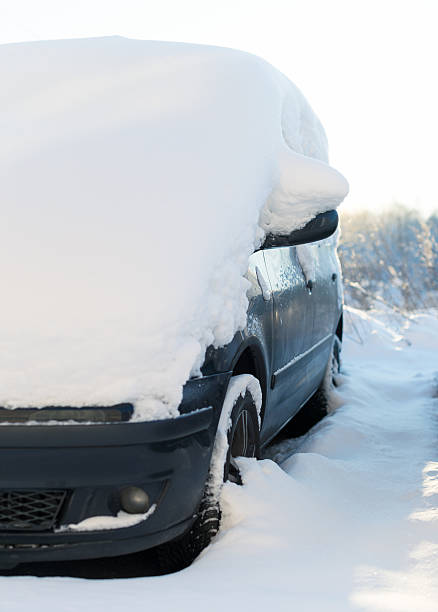 istock Car covered with snow in the winter. 504492134