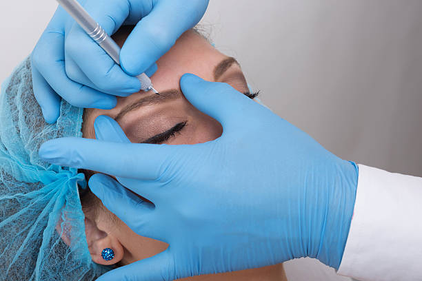 istock Young woman getting a permanent eyebrow make up treatment 504492266