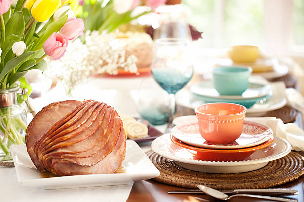 istock Easter Dining Mother's Day Table Place Setting and Ham Brunch 504492786