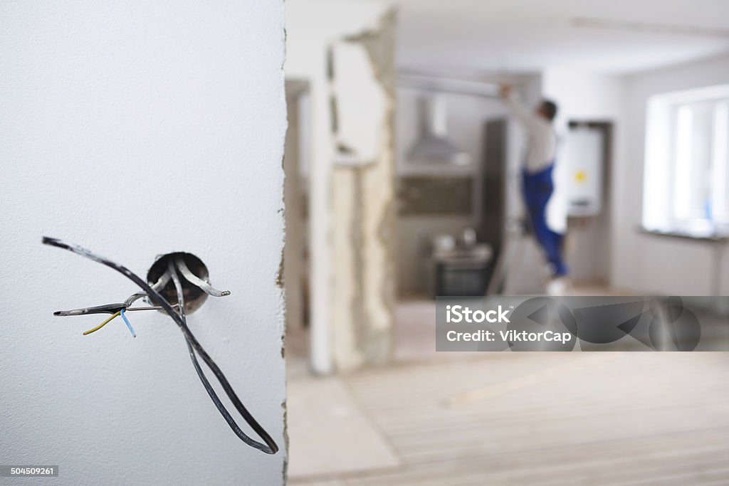 Electrical installations in an apartment Electrical installations in an apartment being rebuilt Electrician Stock Photo