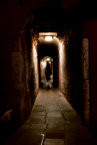 Night alley with a ghost image