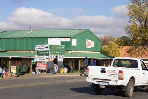 Underberg, South Africa - May 22, 2014: People and cars' registration plates are visible in the small KwaZulu-Natal town of Underberg.