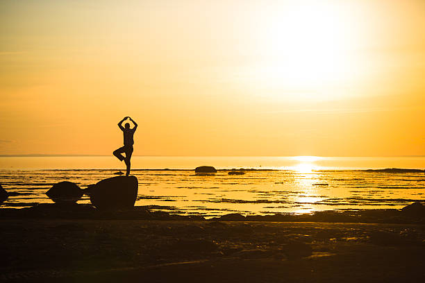 istock Yoga on the beach at Sunset. 504511505